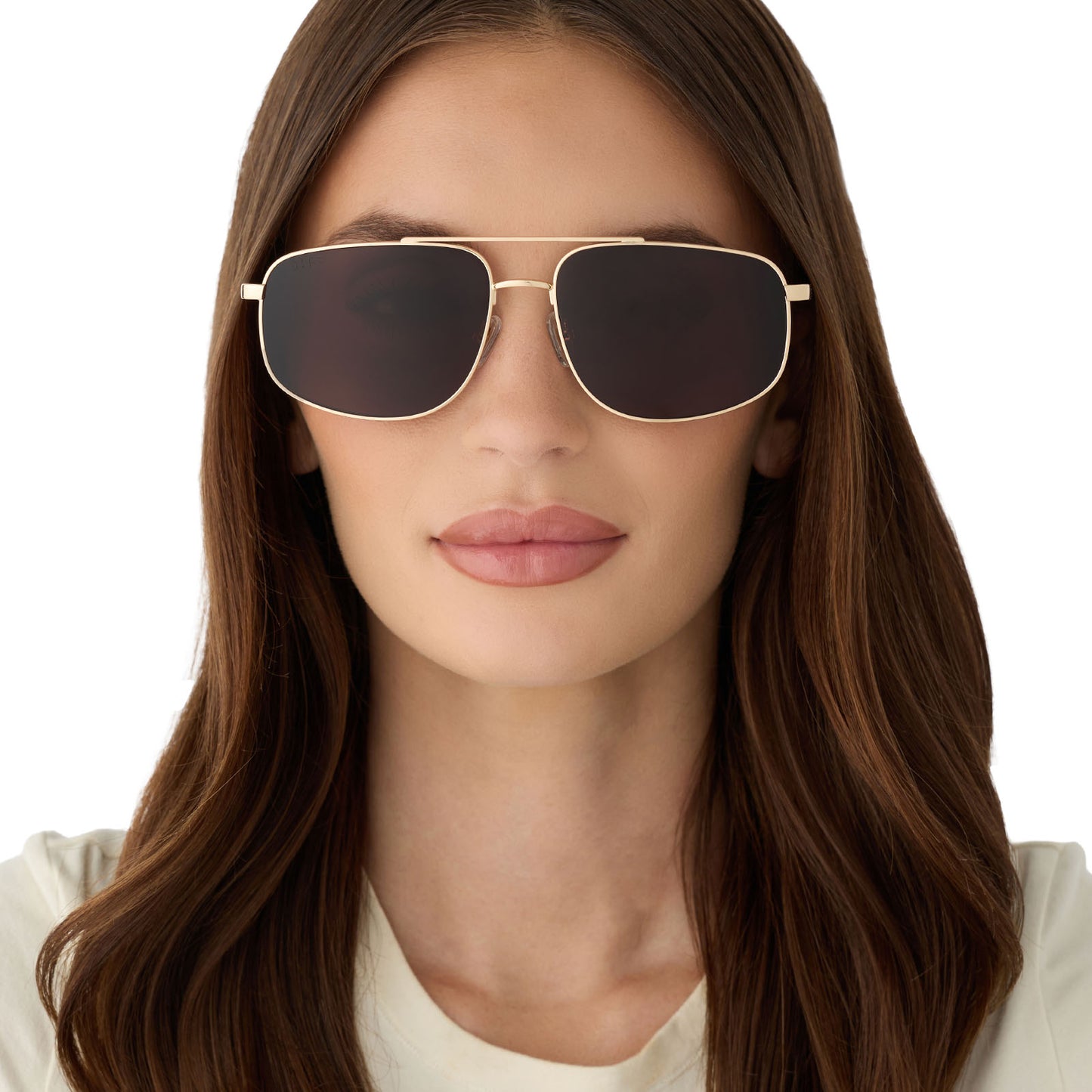 on model - female wearing diff eyewear featuring the charley navigator sunglasses with a gold metal frame and brown polarized lenses front view