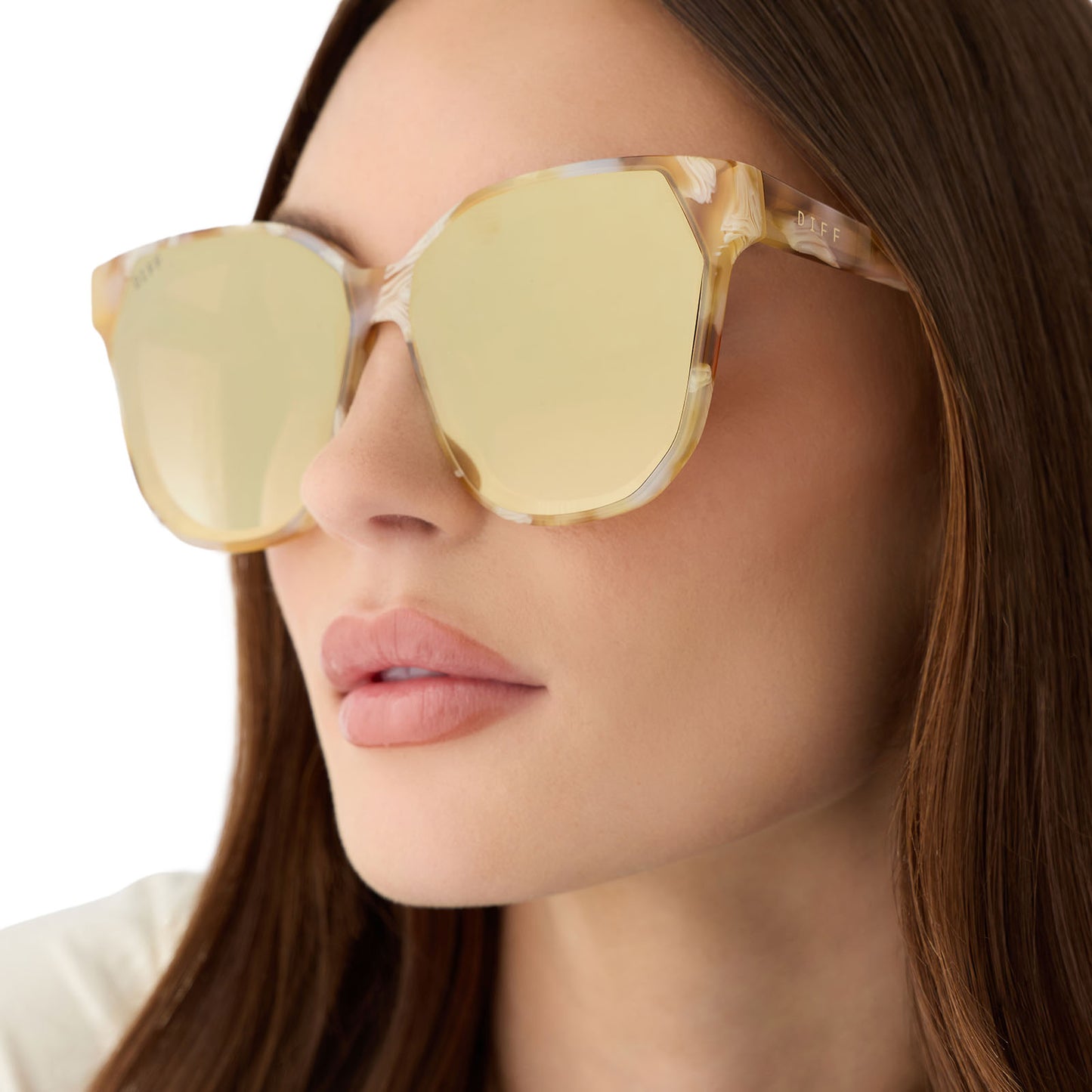 on model - female wearing diff eyewear gia square oversized sunglasses with a gilded tortoise acetate frame and brown gradient with light gold flash lenses detailed view