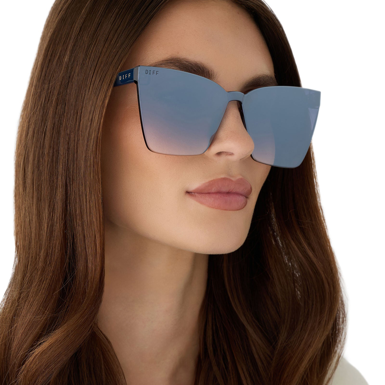 on model - female wearing diff eyewear featuring the goldie cateye sunglasses with a clubhouse blue frame and slate gradient flash lenses angled view