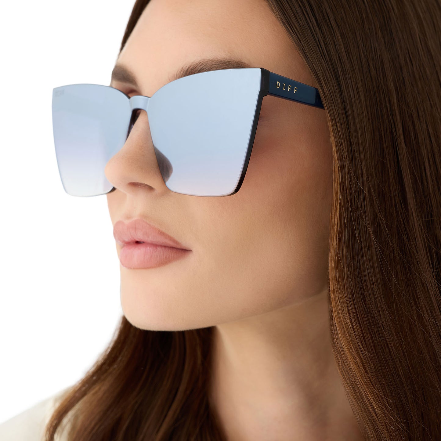on model - female wearing diff eyewear featuring the goldie cateye sunglasses with a clubhouse blue frame and slate gradient flash lenses detailed view