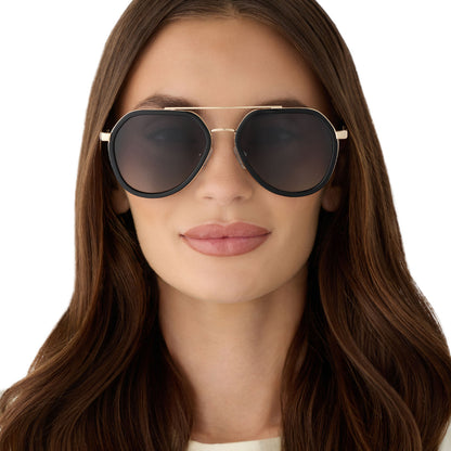 on model - female wearing diff eyewear featuring the joey round sunglasses with a black & gold metal frame with grey gradient polarized lenses front view