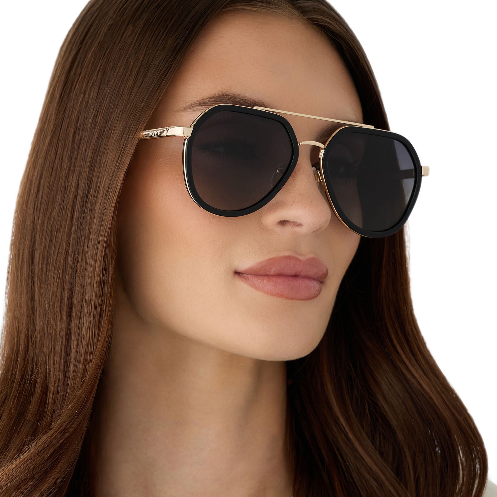 on model - female wearing diff eyewear featuring the joey round sunglasses with a black & gold metal frame with grey gradient polarized lenses angled view