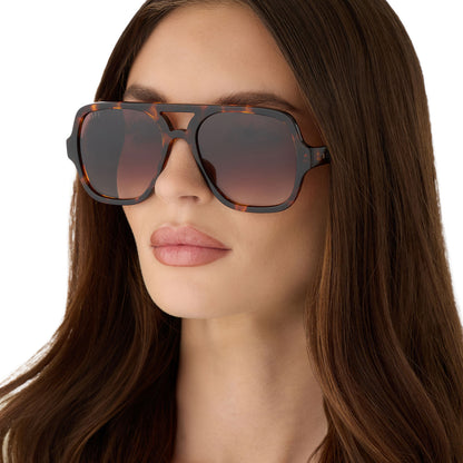 on model - female wearing diff eyewear featuring the layton navigator sunglasses with a rich tortoise acetate frame and brown gradient lenses angled view