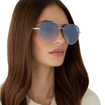 on model - female wearing diff eyewear featuring the lenox aviator sunglasses with a champagne gold (light gold) frame and blue slate gradient flash lenses angled view