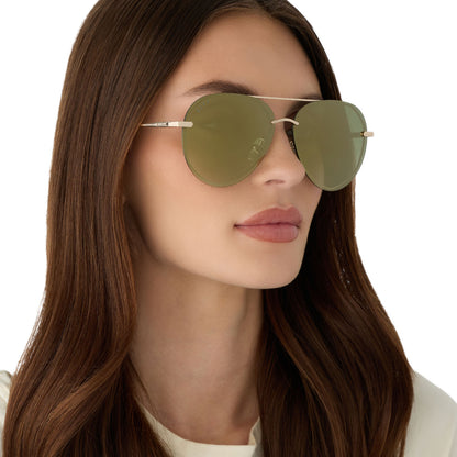 on model - female wearing diff eyewear featuring the lenox aviator sunglasses with a gold metal frame and aloe green gradient w/ light gold flash polarized lenses angled view