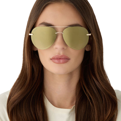 on model - female wearing diff eyewear featuring the lenox aviator sunglasses with a gold metal frame and aloe green gradient w/ light gold flash polarized lenses front view