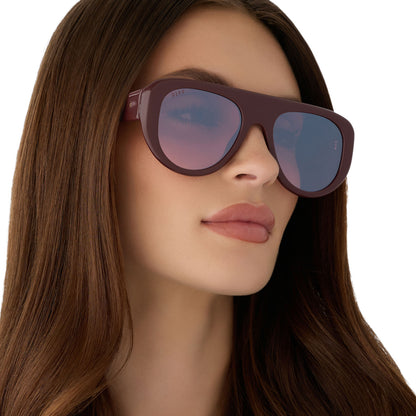 on model - female wearing diff eyewear featuring the morgan oversized navigator sunglasses with a rugby red acetate frame and burgundy gradient lenses angled view