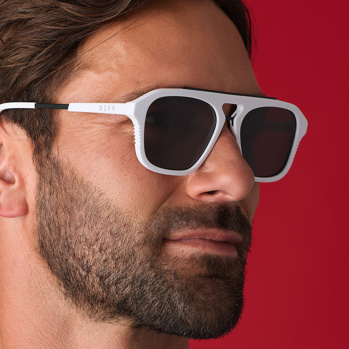 on model - male wearing star wars x diff eyewear featuring the stormtrooper 3.0 navigator sunglasses with a white acetate frame and grey polarized lenses angled view