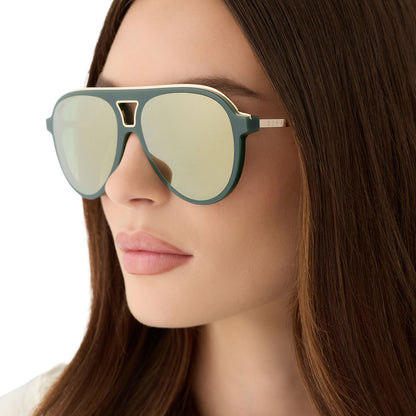 on model - female wearing diff eyewear featuring the tosca iii aviator sunglasses with a fairway green acetate with gold accentsframe  and aloe green gradient w/ light gold flash lenses angled view