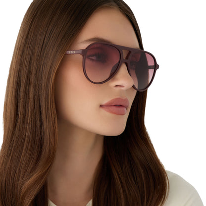 on model - female wearing diff eyewear tosca ii aviator sunglasses with a rugby red acetate frame and burgundy gradient polarized lenses angled view