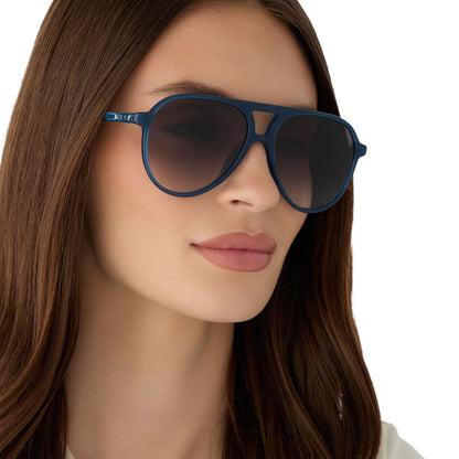 on model - female wearing diff eyewear featuring the tosca ii aviator sunglasses with a clubhouse blue frame and grey gradient lenses angled view