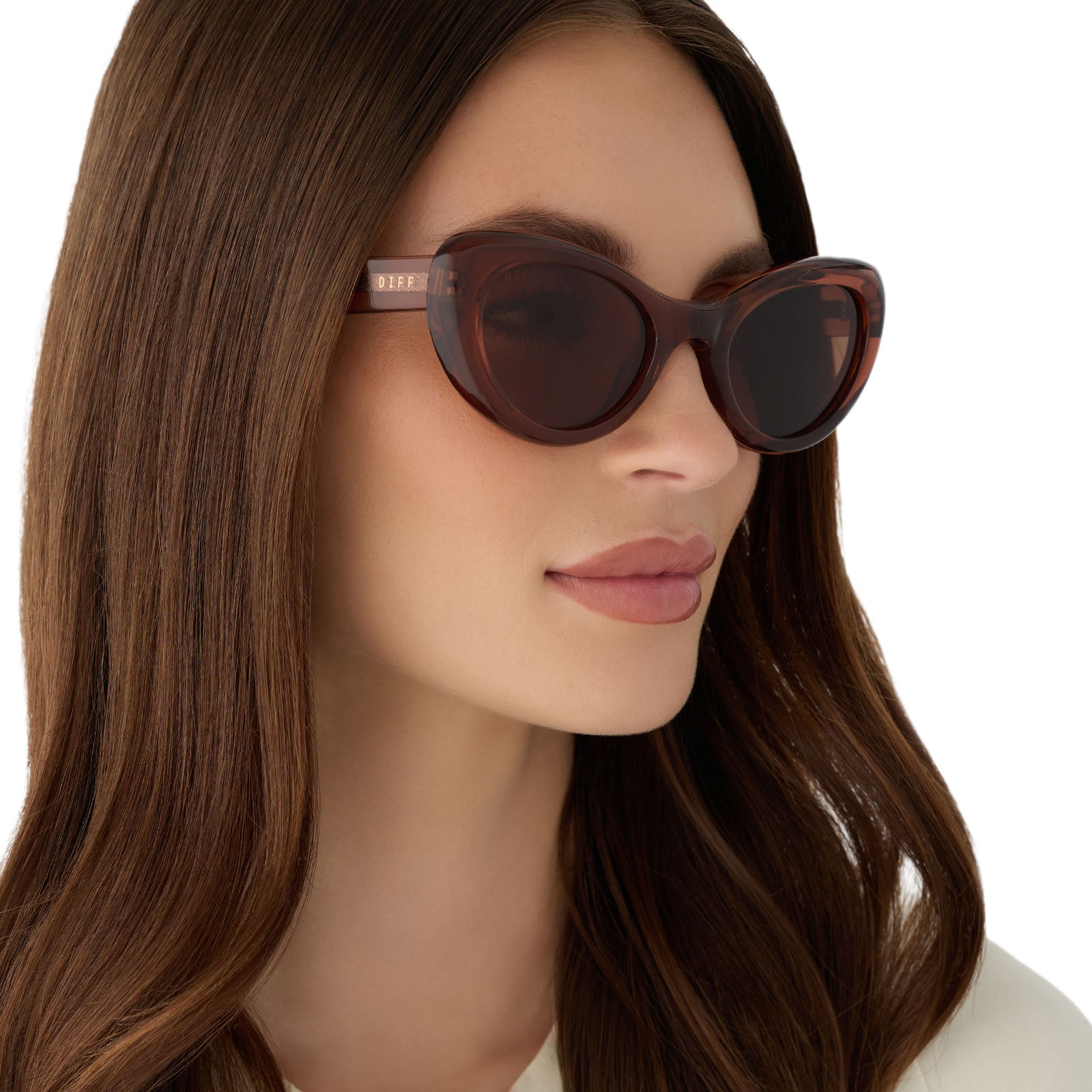 on model - female wearing diff eyewear featuring the zaria cateye sunglasses with a café ole acetate frame and brown lenses angled view