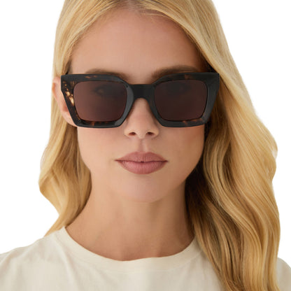 on model - female wearing diff eyewear featuring the greer square sunglasses with a espresso tortoise frame and brown gradient lenses front view