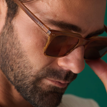 on model - male wearing diff eyewear featuring the billie square sunglasses with a longhorn brown frame and brown polarized lenses detailed view
