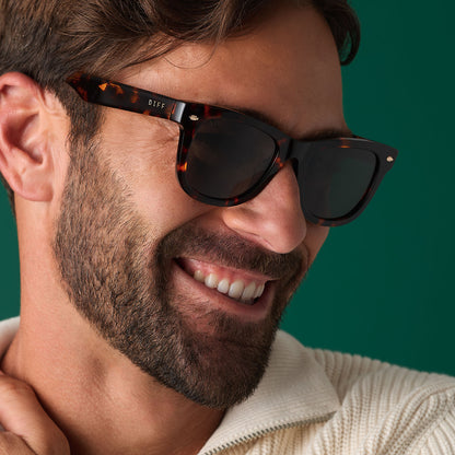 on model - male wearing diff eyewear mercer square sunglasses with a rich tortoise acetate frame and g15 polarized lenses angled view