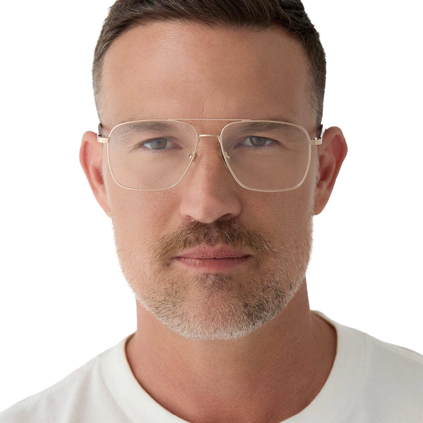 on model - male wearing yellowstone x diff eyewear featuring the rip wheeler navigator prescription glasses with a gold frame front view