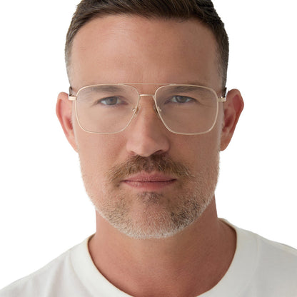on model - male wearing yellowstone x diff eyewear featuring the rip wheeler navigator prescription glasses with a gold frame front view
