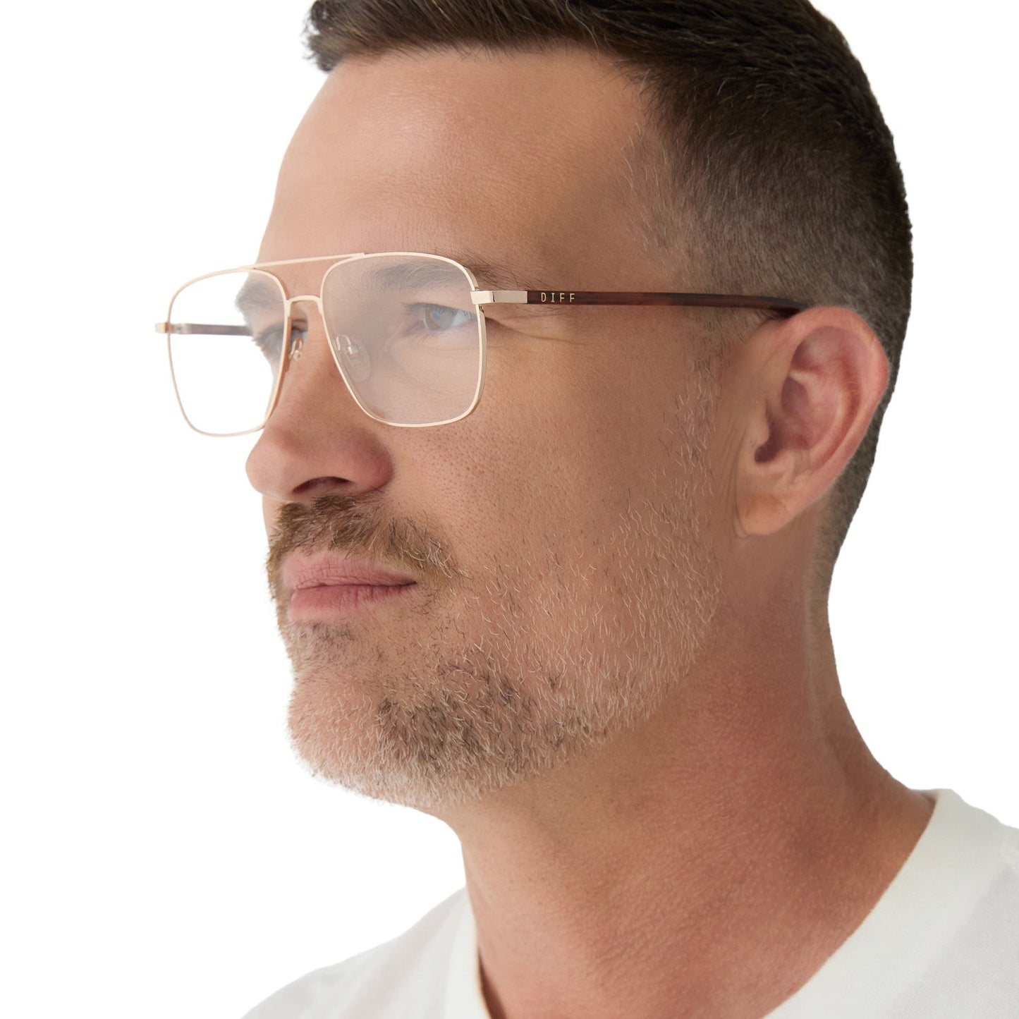 on model - male wearing yellowstone x diff eyewear featuring the rip wheeler navigator prescription glasses with a gold frame side view
