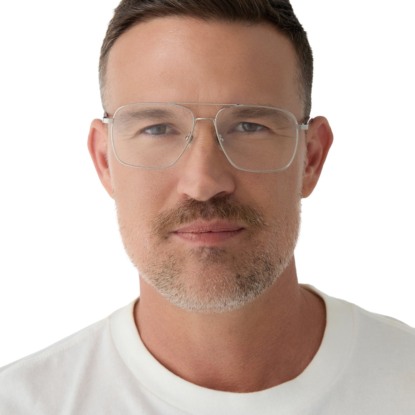 on model - male wearing yellowstone x diff eyewear featuring the rip wheeler navigator prescription glasses with a silver frame front view