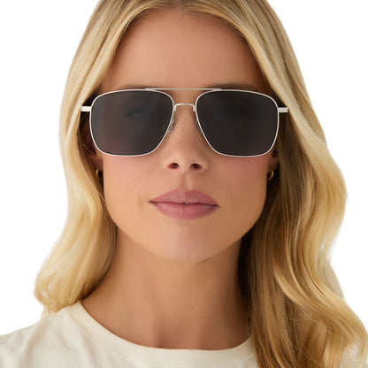 on model - female wearing yellowstone x diff eyewear featuring the rip wheeler navigator sunglasses with a silver frame and grey polarized lenses front view