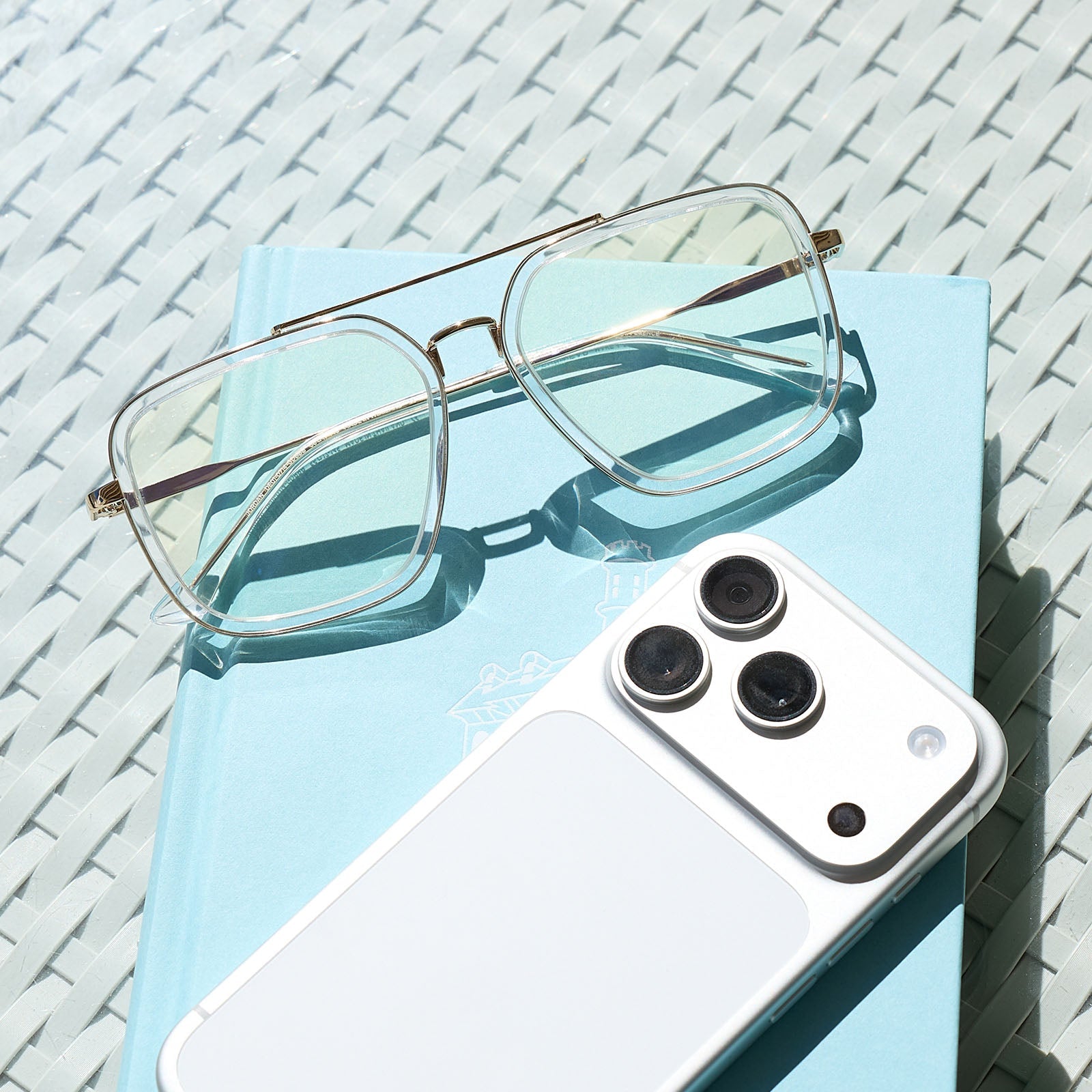 still life of diff eyewear jordan navigator prescription glasses with a gold frame, clear crystal temple tips front view