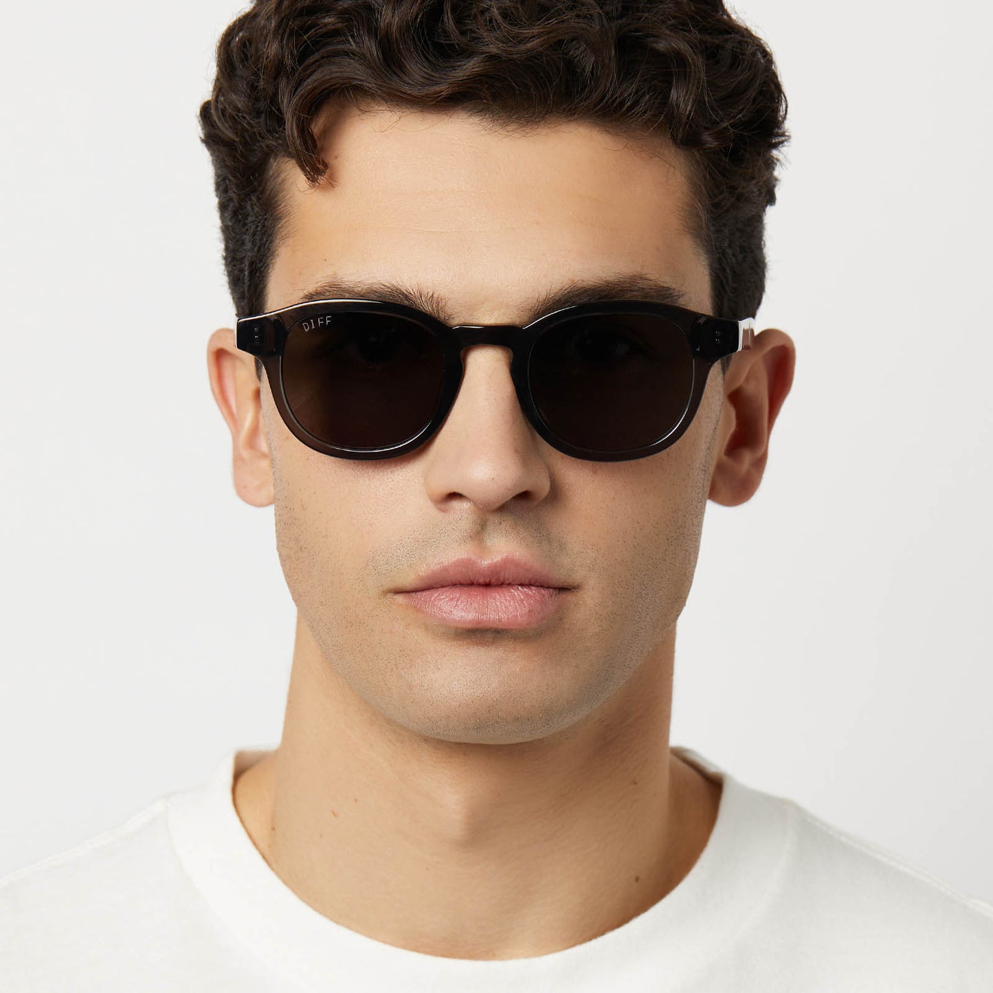 on model - male wearing diff eyewear featuring the arlo xl round sunglasses with a black smoke crystal frame and grey polarized lenses front view