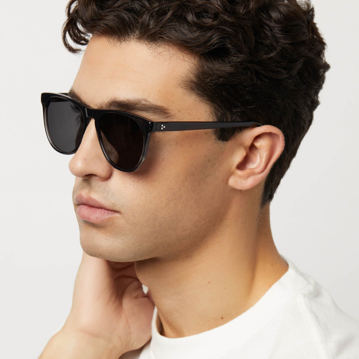 on model - male wearing diff eyewear featuring the darren square sunglasses with a black smoke crystal frame and grey polarized lenses detailed view