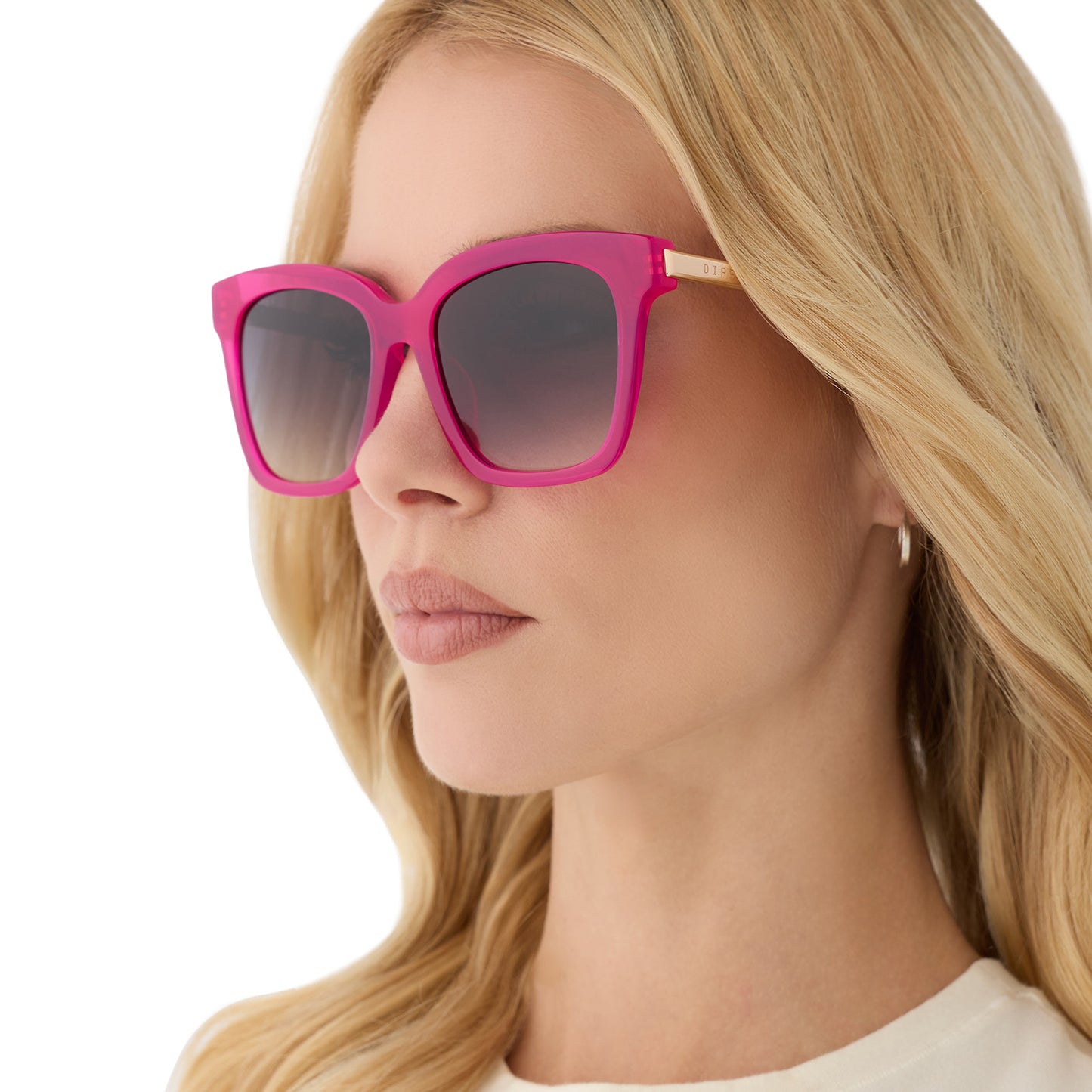 on model - female wearing diff eyewear featuring the bella square sunglasses with a bright tulip with gold frame and grey gradient lenses angled view