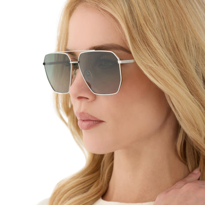 on model - blonde female wearing diff eyewear featuring the berkely navigator sunglasses with a silver frame and cool matcha gradient lenses angled view