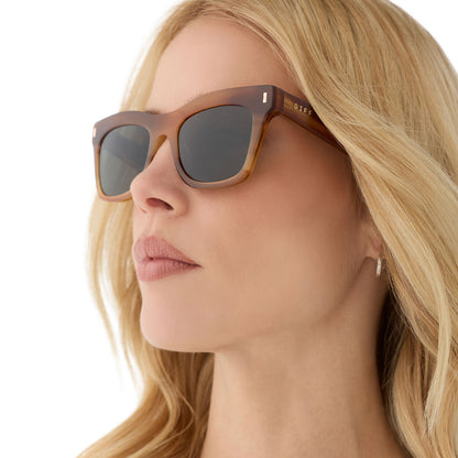 on model - female wearing diff eyewear featuring the bradley cateye sunglasses with a tawny brown tortoise frame and g15 polarized lenses angled view
