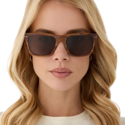 on model - female wearing diff eyewear featuring the gino xl square sunglasses with a longhorn brown frame and brown polarized lenses front view