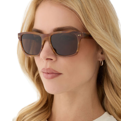 on model - female wearing diff eyewear featuring the gino xl square sunglasses with a longhorn brown frame and brown polarized lenses angled view