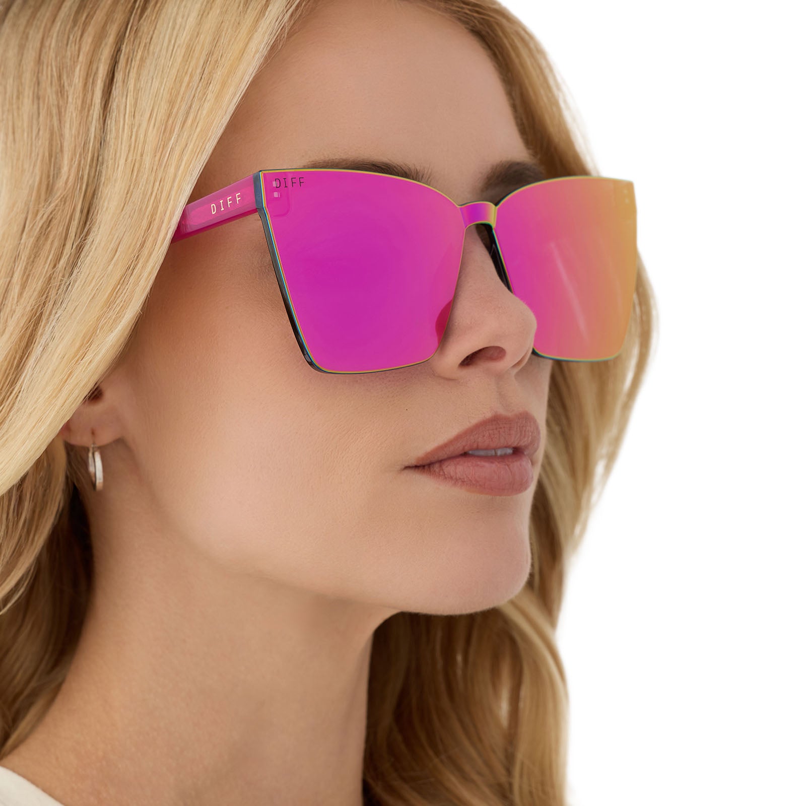 on model - female wearing diff eyewear featuring the goldie cat eye sunglasses with a bright tulip frame and pink rush mirror lenses angled view