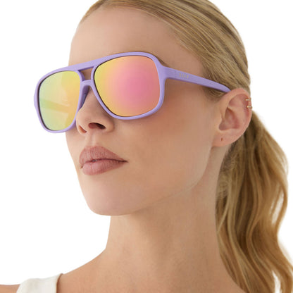 on model - female wearing diff sport featuring the hangtime aviator sunglasses with a matte lavender frame and sherbet mirror polarized lenses angled view