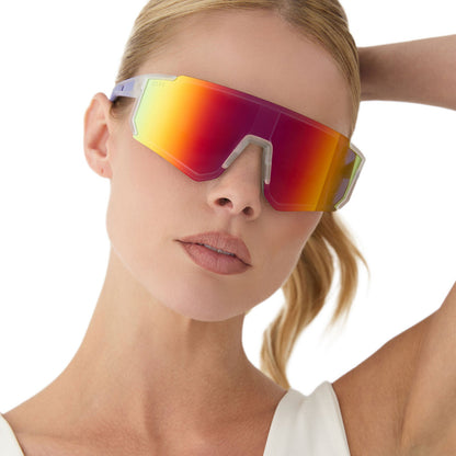 on model - female wearing diff sport featuring the heat shield sunglasses with a crystal clear frame and rainbow mirror polarized lenses front view