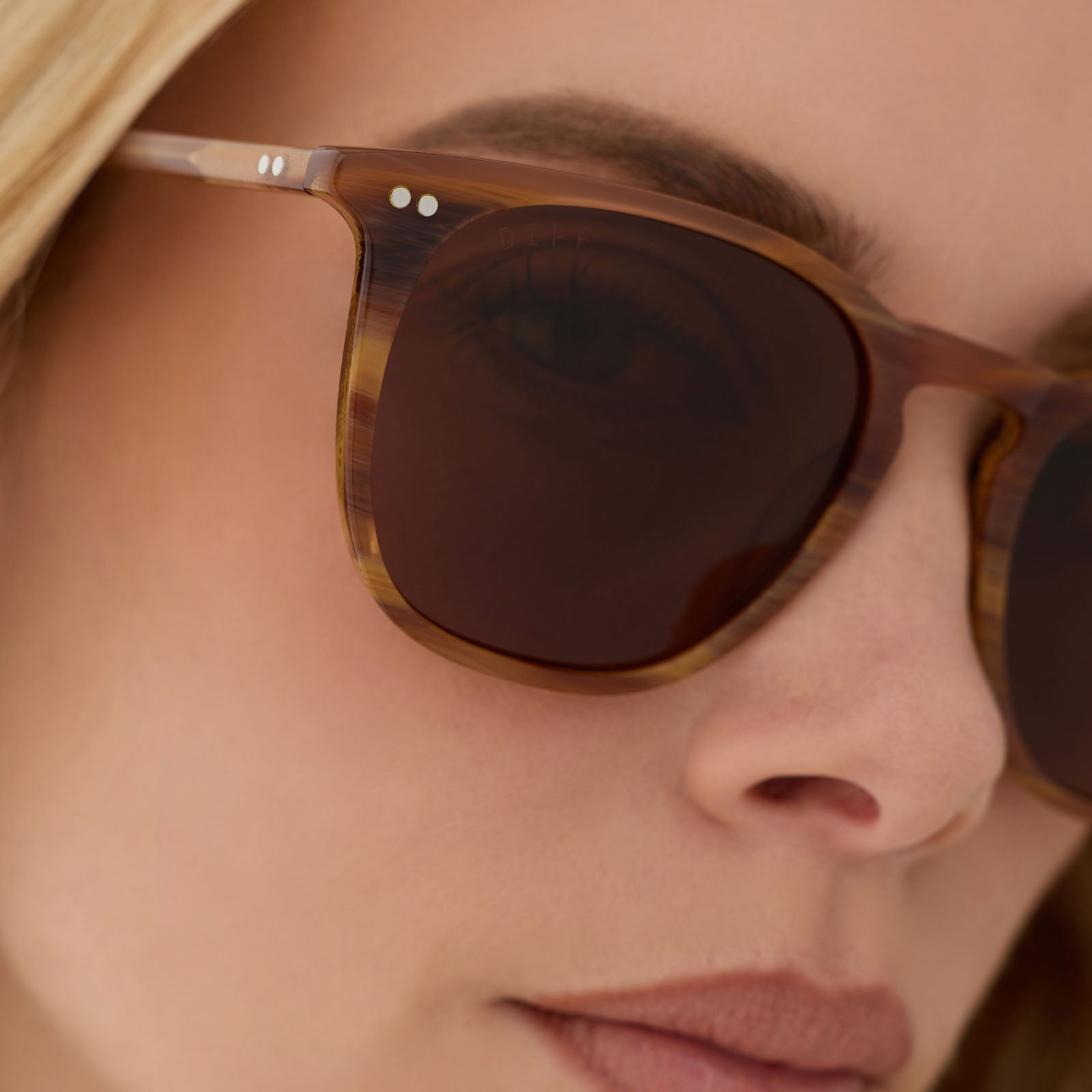 on model - female wearing diff eyewear featuring the maxwell xl square sunglasses with a longhorn brown frame and brown polarized lenses detailed view