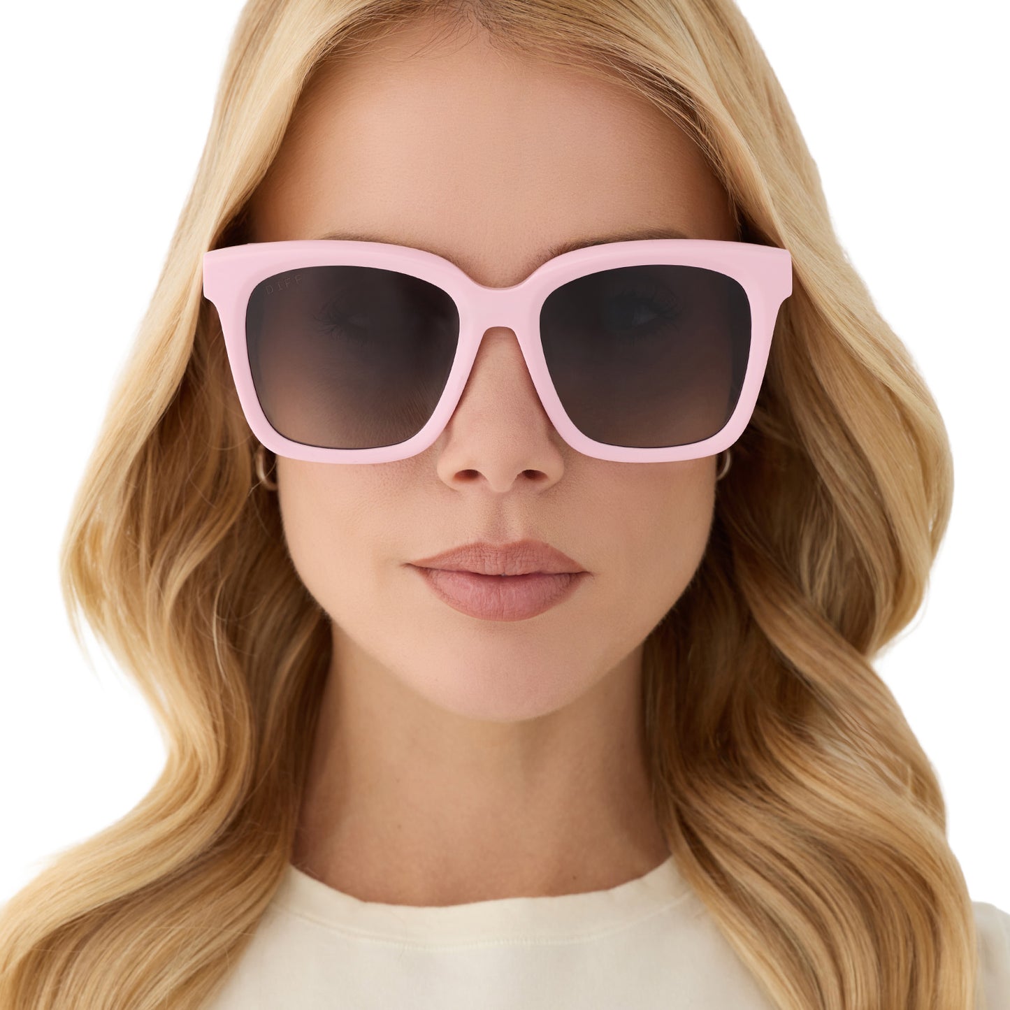 on model - female wearing diff eyewear featuring the meredith square sunglasses with a powder pink frame and grey gradient polarized lenses front view