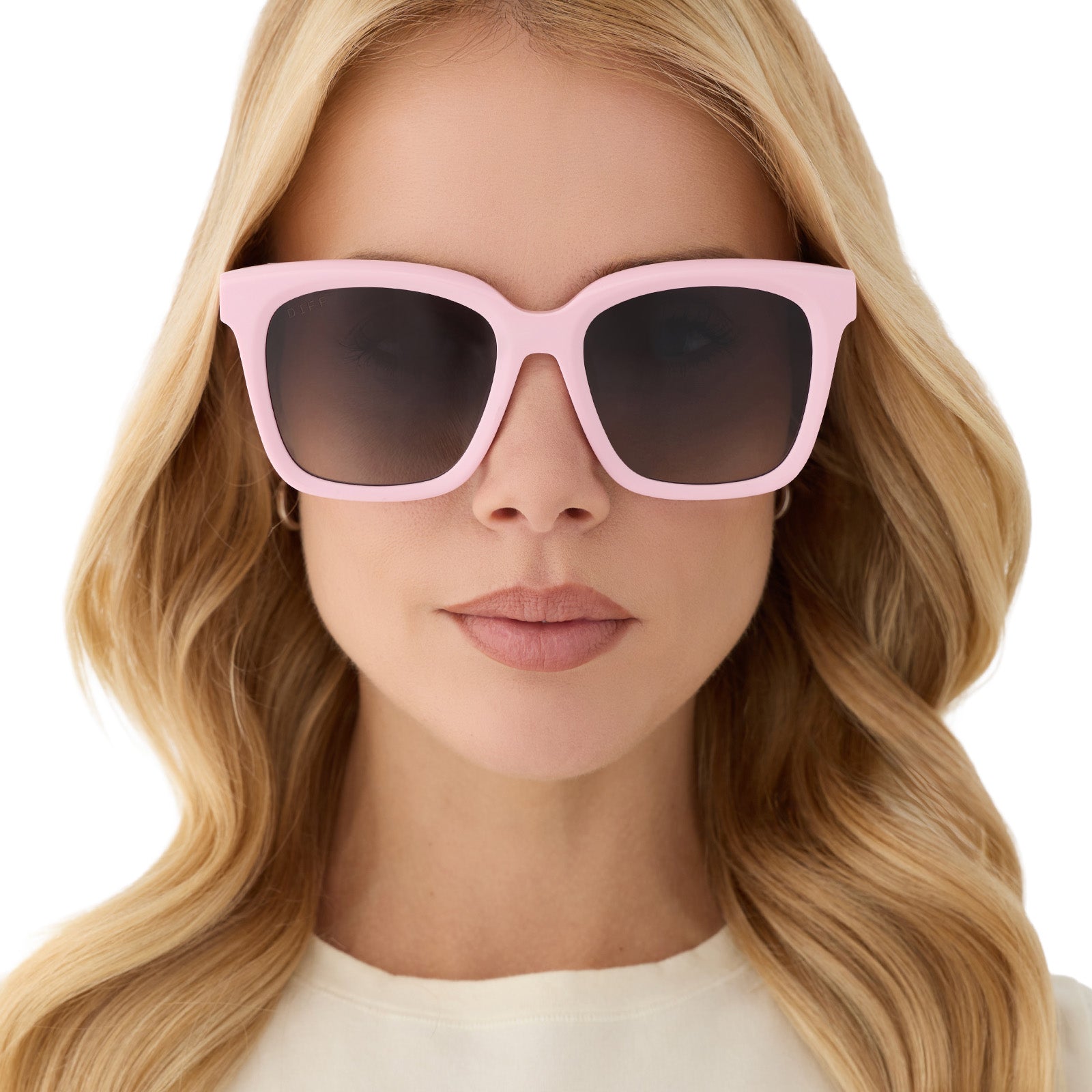 on model - female wearing diff eyewear featuring the meredith square sunglasses with a powder pink frame and grey gradient polarized lenses front view
