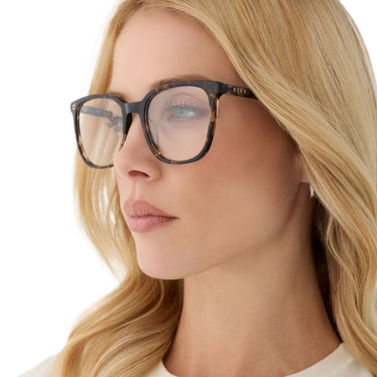 on model - female wearing diff eyewear featuring the parker square blue light technology glasses with a espresso tortoise frame angled view