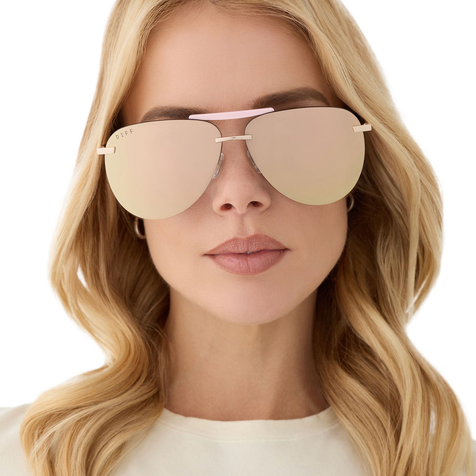 on model - female wearing diff eyewear featuring the tahoe aviator sunglasses with a gold with powder pink brow bar & temple tips frame and taupe mirror lenses front view