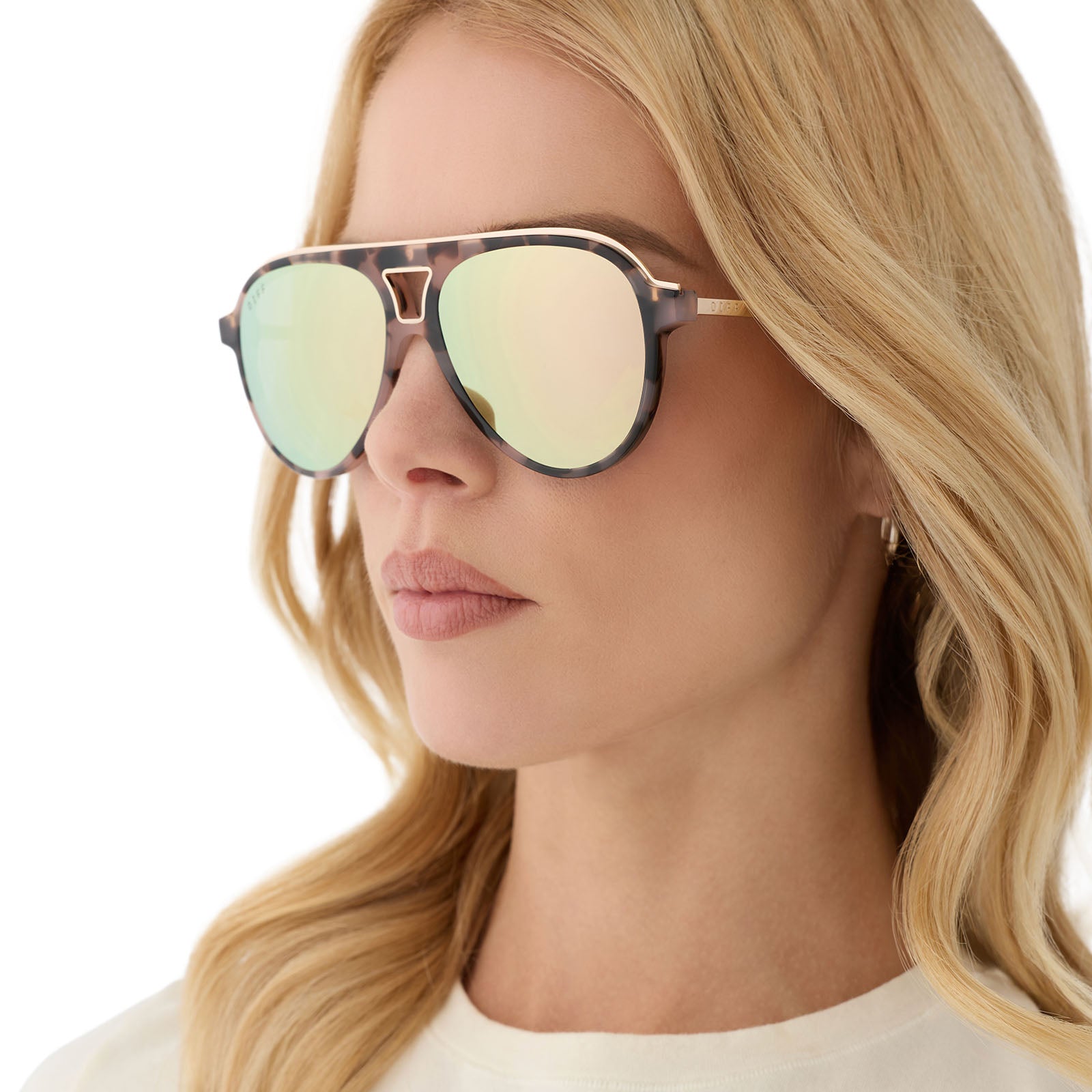 on model - female wearing diff eyewear featuring the tosca iii aviator sunglasses with a himalayan brown tortoise frame and taupe mirror lenses angled view