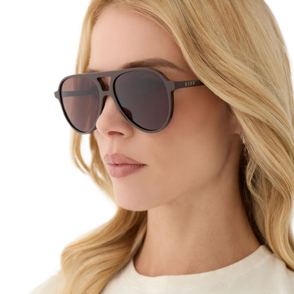 on model - female wearing diff eyewear featuring the tosca ii aviator sunglasses with a truffle brown frame and truffle lenses angled view