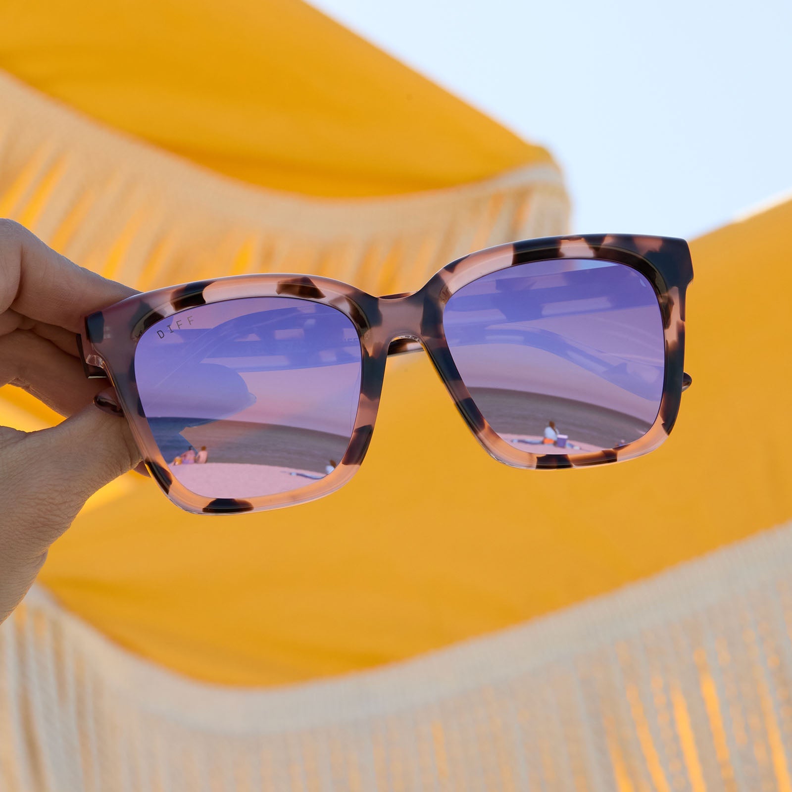 lifestyle - still life of diff eyewear meredith square sunglasses in tortoise pink