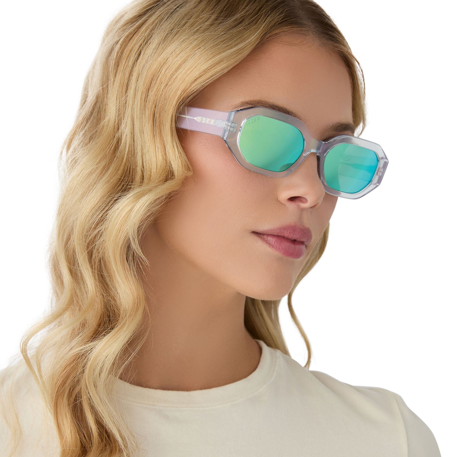 on model - blonde female wearing diff eyewear allegra square sunglasses with a opalescent turquoise acetate frame and turquoise ice mirror lenses angled view