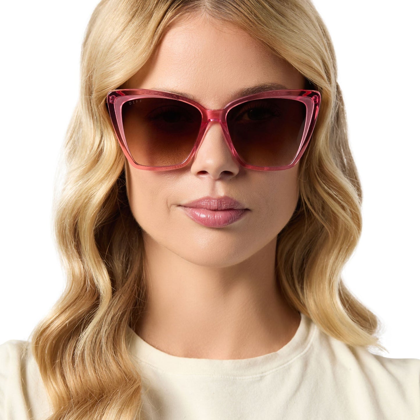 on model - female wearing diff eyewear featuring the becky ii cateye sunglasses with a candy pink crystal frame and brown gradient lenses front view