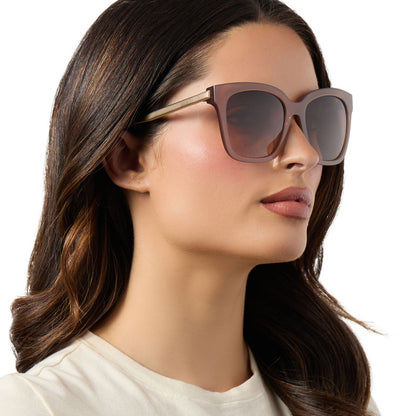 on model - female wearing diff eyewear bella oversized square sunglasses with a macchiato brown frame and brown gradient polarized lenses side view