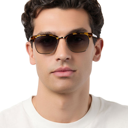 on model - male wearing diff eyewear biarritz square sunglasses with a amber tortoise frame and blue gradient polarized lenses front view