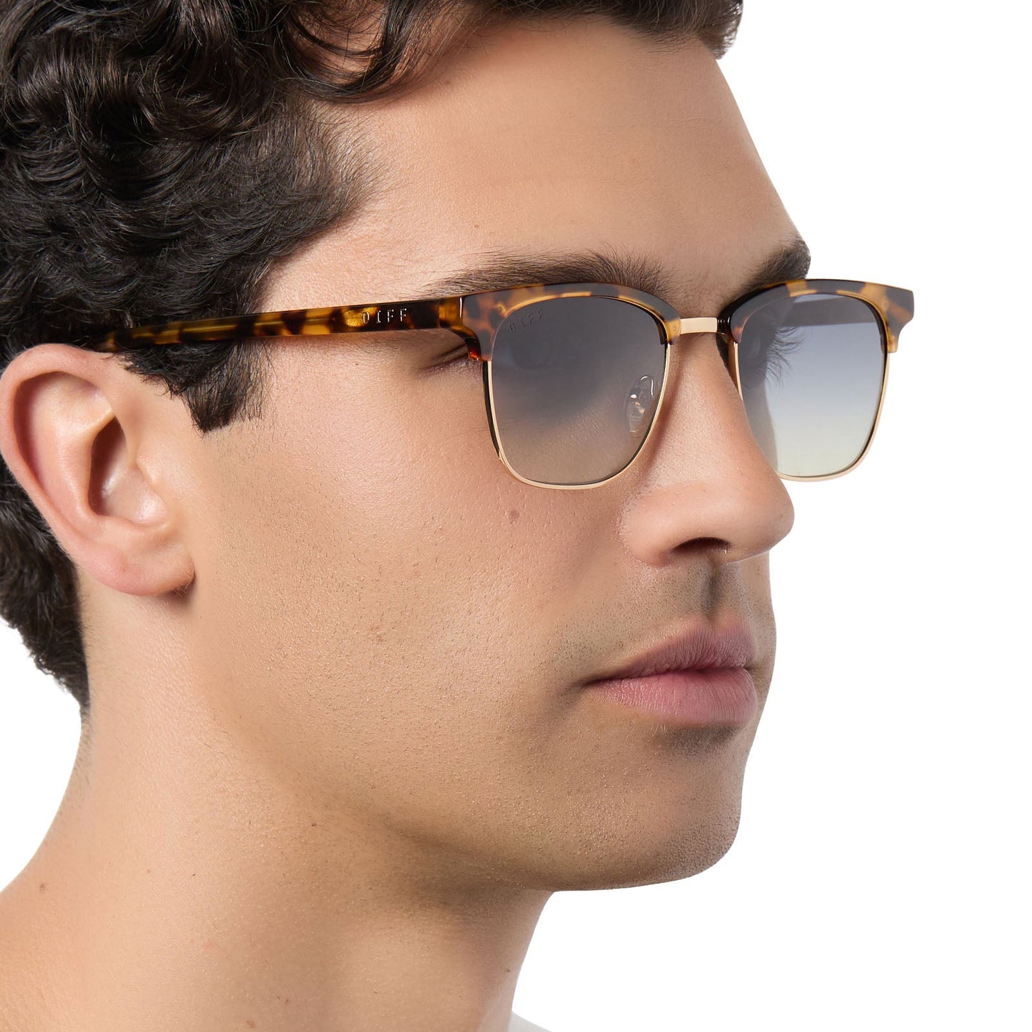 on model - male wearing diff eyewear biarritz square sunglasses with a amber tortoise frame and blue gradient polarized lenses side view