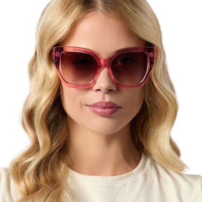 on model - female wearing diff eyewear blaire oversized square sunglasses with a candy pink crystal acetate frame and brown gradient lenses front view