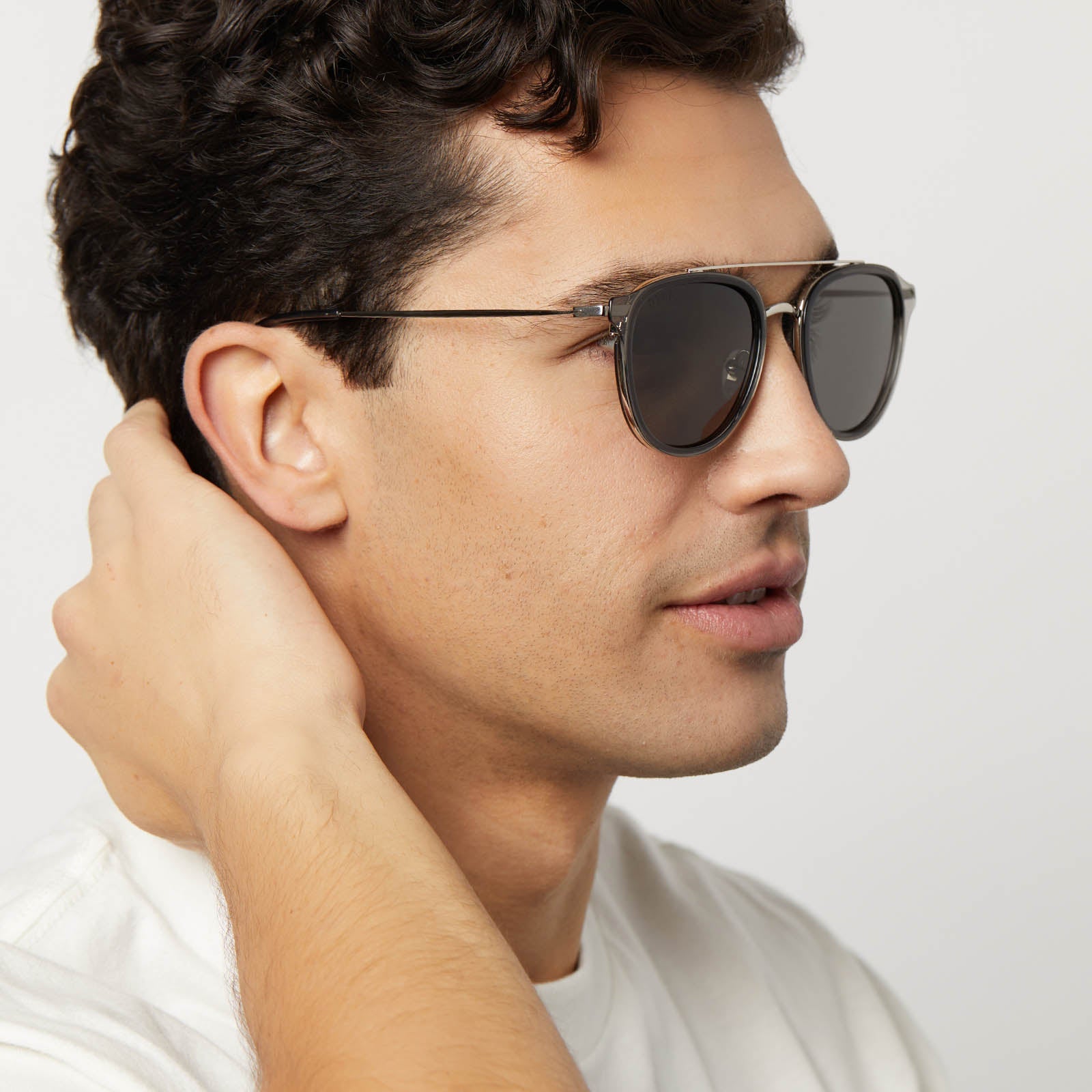 on model - male wearing diff eyewear featuring the camden aviator sunglasses with a black smoke crystal frame and grey polarized lenses side view